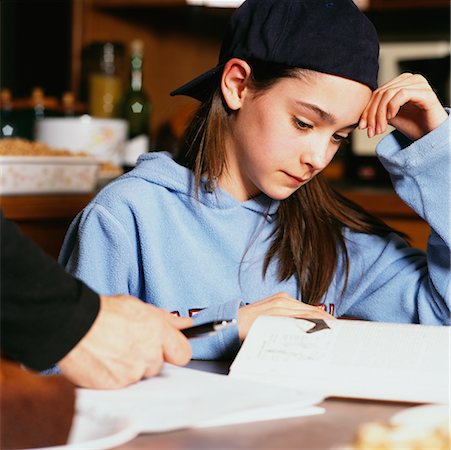 pen two hands - Girl Doing Homework Stock Photo - Rights-Managed, Code: 700-00268966