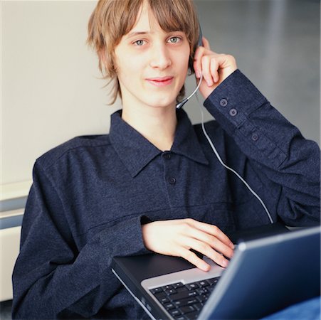 Young Man with Laptop Computer Stock Photo - Rights-Managed, Code: 700-00268986