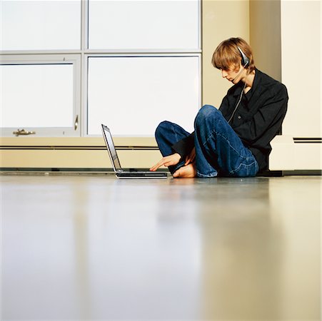 Young Man with Laptop Computer On Floor Stock Photo - Rights-Managed, Code: 700-00268982