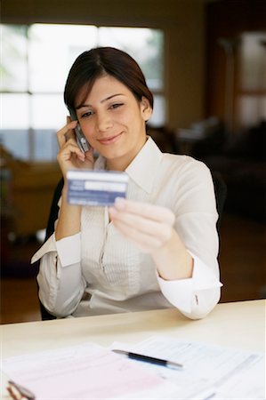 phone young woman card - Woman on Phone Holding Credit Card Stock Photo - Rights-Managed, Code: 700-00269271