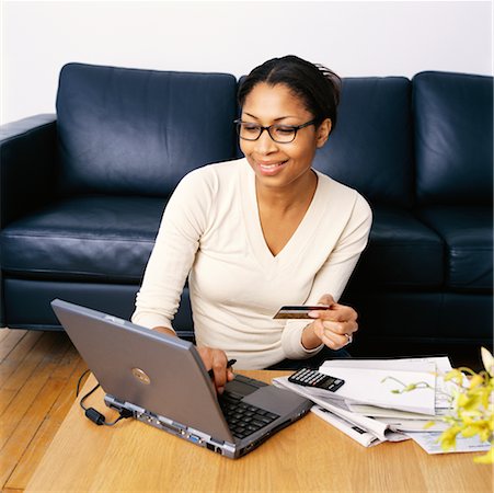 Woman Holding Credit Card, Using Laptop Computer Stock Photo - Rights-Managed, Code: 700-00269464