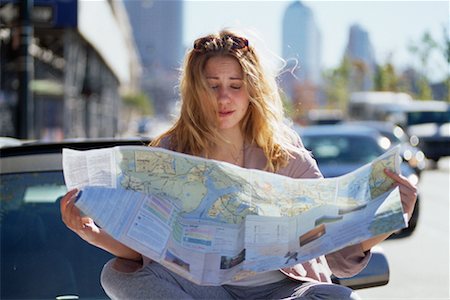 sitting car hood - Woman Reading Map Stock Photo - Rights-Managed, Code: 700-00269720