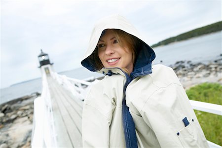 raincoat hood - Woman with Raincoat on Boardwalk Stock Photo - Rights-Managed, Code: 700-00269786