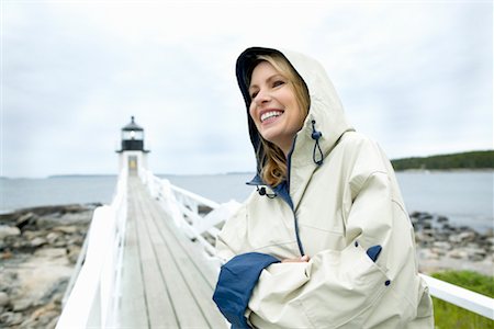 raincoat hood - Woman with Raincoat on Boardwalk Stock Photo - Rights-Managed, Code: 700-00269787