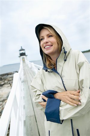 raincoat hood - Woman with Raincoat on Boardwalk Stock Photo - Rights-Managed, Code: 700-00269788