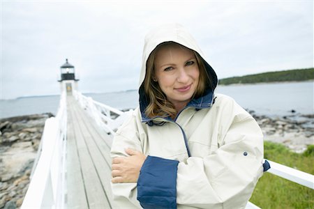 raincoat hood - Woman with Raincoat on Boardwalk Stock Photo - Rights-Managed, Code: 700-00269789
