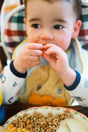 simsearch:600-01015388,k - Baby Eating in High Chair Stock Photo - Rights-Managed, Code: 700-00269909