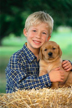simsearch:700-00814363,k - Portrait of Boy with Puppy Foto de stock - Con derechos protegidos, Código: 700-00262832