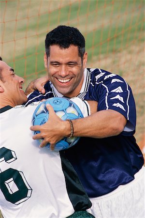 person playing soccer standing back - Soccer Players Hugging Stock Photo - Rights-Managed, Code: 700-00274971