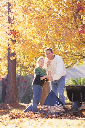 raking leaves - Father and Daughter Raking Leaves Stock Photo - Rights-Managed, Code: 700-00275019