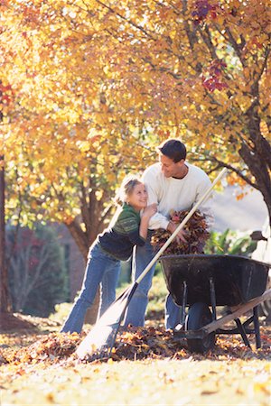 raking leaves - Father and Daughter Raking Leaves Stock Photo - Rights-Managed, Code: 700-00275021