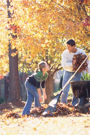 raking leaves - Father and Daughter Raking Leaves Stock Photo - Rights-Managed, Code: 700-00275022
