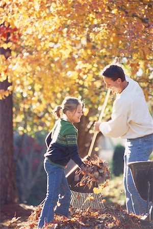 raking leaves - Father and Daughter Raking Leaves Stock Photo - Rights-Managed, Code: 700-00275023