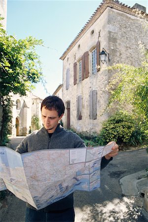 Man Looking at a Map Stock Photo - Rights-Managed, Code: 700-00279854