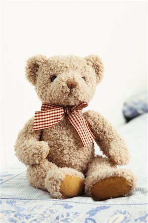 furry teddy bear - Teddy Bear on Bed Stock Photo - Rights-Managed, Code: 700-00270143