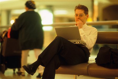 simsearch:700-02797980,k - Businessman with Laptop in Airport Stock Photo - Rights-Managed, Code: 700-00270493