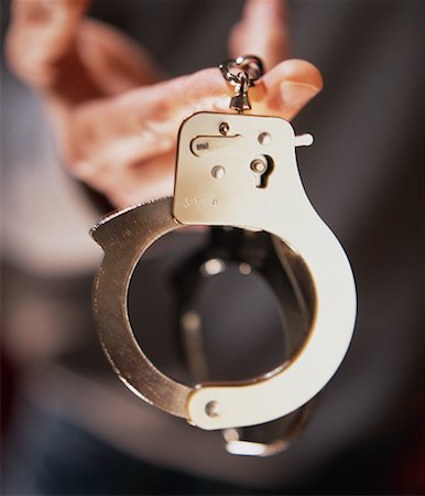 simsearch:700-00161018,k - Man Holding Handcuffs Stock Photo - Rights-Managed, Code: 700-00270715