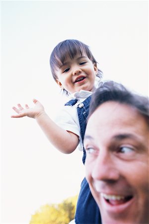 shoulder ride side view - Father with Son on Shoulders Stock Photo - Rights-Managed, Code: 700-00285221
