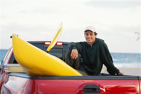 portrait and kayak - Young Man Sitting on Back of Pickup Truck with Kayak Stock Photo - Rights-Managed, Code: 700-00285323