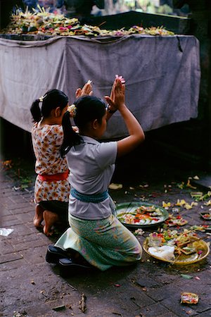 praying asian girls kneeling - Woman Worshipping Stock Photo - Rights-Managed, Code: 700-00285400