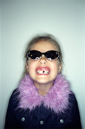 Portrait of Girl with Missing Tooth Stock Photo - Rights-Managed, Code: 700-00285477