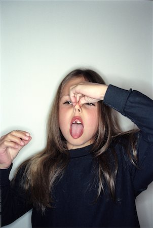 Girl Holding her Nose Stock Photo - Rights-Managed, Code: 700-00285471