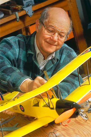 Man Building Model Airplane Stock Photo - Rights-Managed, Code: 700-00285825