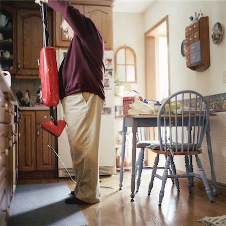 simsearch:630-06723595,k - Man Vacuuming Stock Photo - Rights-Managed, Code: 700-00285928