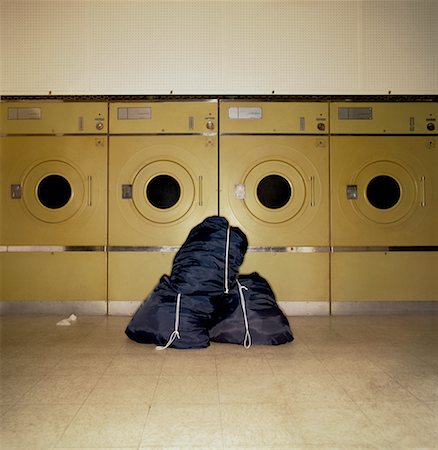 row of sacks - Bags of Laundry in Laundromat Stock Photo - Rights-Managed, Code: 700-00286353