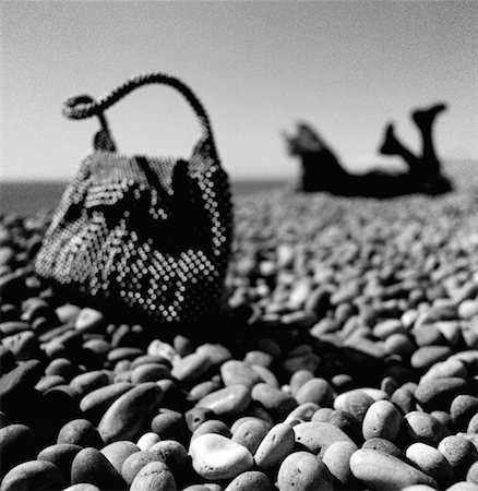 Woman and Purse on Pebble Beach Stock Photo - Rights-Managed, Code: 700-00286437