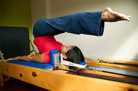 pilates reformer - Woman Doing Pilates Stock Photo - Rights-Managed, Code: 700-00286525