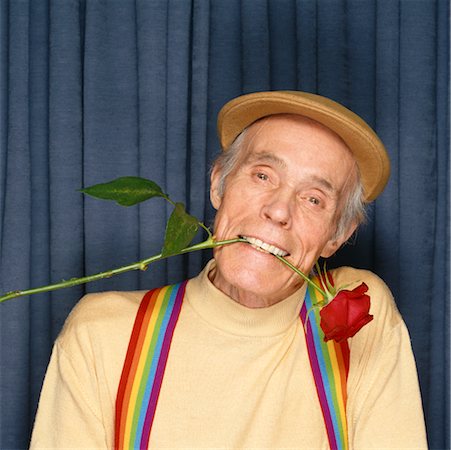Man with rose in mouth Stock Photos - Page 1 : Masterfile