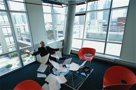 Businessman Throwing Papers In the Air Stock Photo - Rights-Managed, Code: 700-00286678