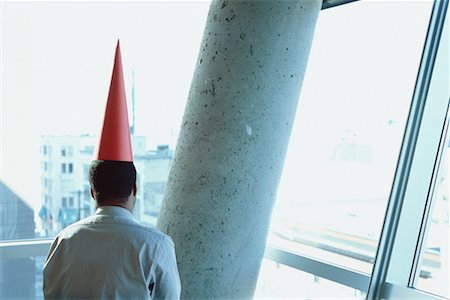 simsearch:700-00078438,k - Businessman with Dunce Cap Foto de stock - Con derechos protegidos, Código: 700-00286680