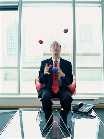 Businessman Juggling in Office Stock Photo - Rights-Managed, Code: 700-00286724