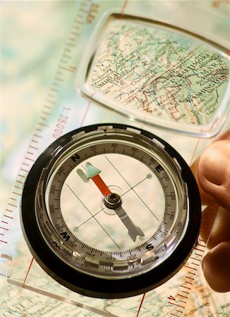 Hand holding Compass with Map Stock Photo - Rights-Managed, Code: 700-00286839