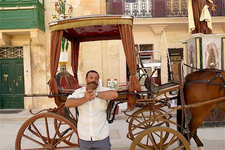 photos of tour guides at work - Guide with Horse and Buggy Mdina, Malta Stock Photo - Rights-Managed, Code: 700-00281142