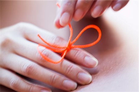 finger knot reminder - String on Woman's Finger Stock Photo - Rights-Managed, Code: 700-00281380