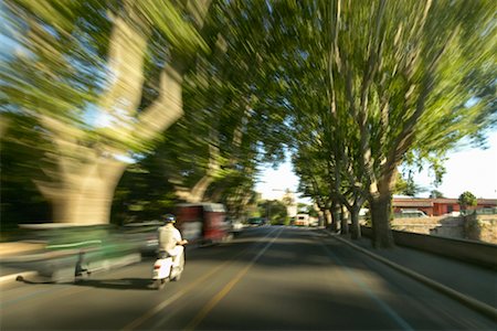 riding bike blur city - Moped on Road Stock Photo - Rights-Managed, Code: 700-00281529