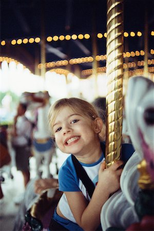 Girl on a Carousel Foto de stock - Con derechos protegidos, Código: 700-00281639