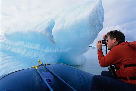 Man Taking Photograph of Iceberg Fotografie stock - Rights-Managed, Codice: 700-00281955