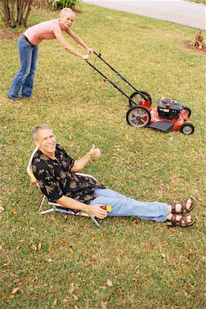 Woman Mowing Lawn Stock Photo - Rights-Managed, Code: 700-00318622