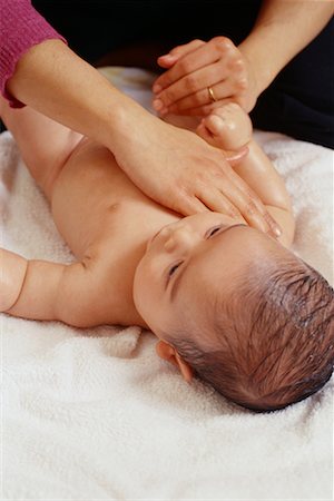 simsearch:700-02957960,k - Mother Massaging Baby Stock Photo - Rights-Managed, Code: 700-00328060