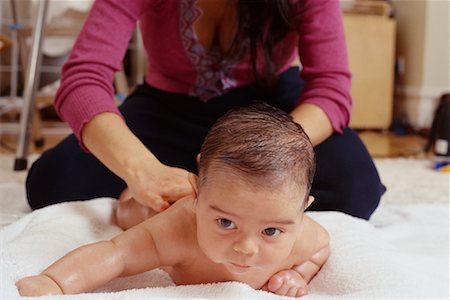 simsearch:700-02957960,k - Mother Massaging Baby Stock Photo - Rights-Managed, Code: 700-00328061