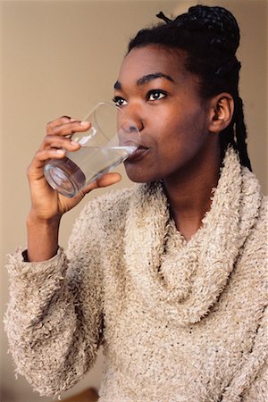 satisfied (thirst) - Woman Drinking Water Foto de stock - Con derechos protegidos, Código: 700-00328259