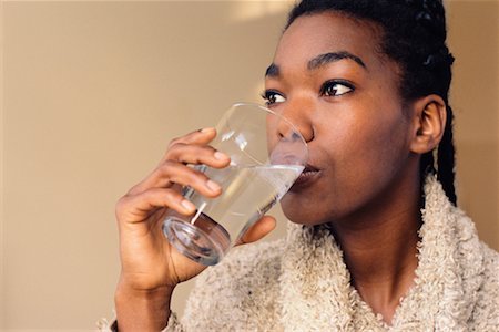 satisfied (thirst) - Woman Drinking Water Foto de stock - Con derechos protegidos, Código: 700-00328260