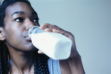 satisfied (thirst) - Woman Drinking Milk Foto de stock - Con derechos protegidos, Código: 700-00328274