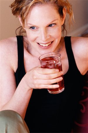 Woman Drinking Juice Foto de stock - Con derechos protegidos, Código: 700-00328290