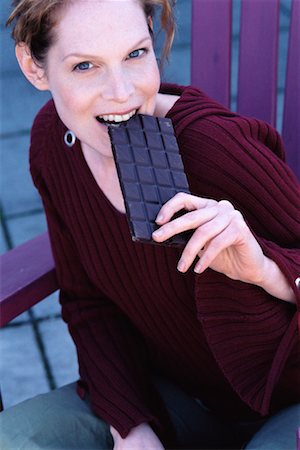 simsearch:614-06168625,k - Woman Eating Chocolate Stock Photo - Rights-Managed, Code: 700-00328316