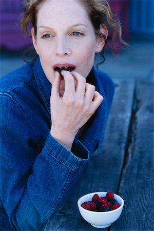 Woman Eating Berries Stock Photo - Rights-Managed, Code: 700-00328321